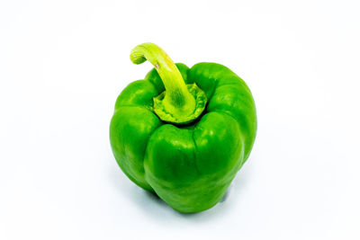Close-up of green bell pepper against white background