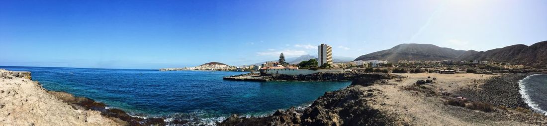 Panoramic view of sea against clear sky
