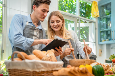 Young couple holding food