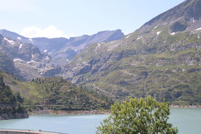 Scenic view of mountains and lake against sky