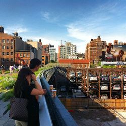 Woman sitting on city street