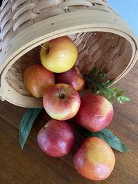 High angle view of apples in basket on table