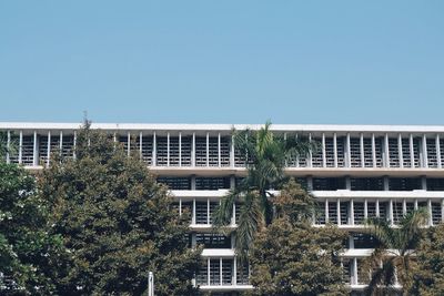 Low angle view of building against clear blue sky