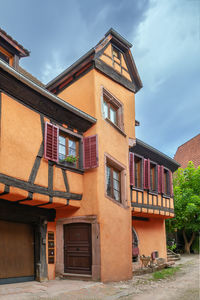 Street with historical houses in ribeauville, alsace, france