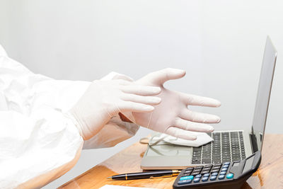 Midsection of woman using mobile phone