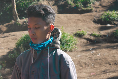 Portrait of boy standing on land