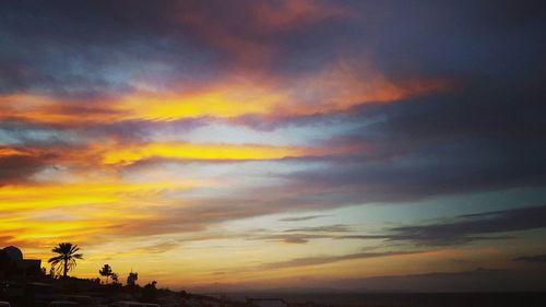 Low angle view of dramatic sky during sunset