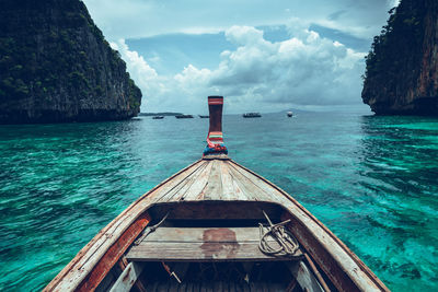 Boats in sea against sky