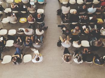 Directly above shot of people sitting in auditorium