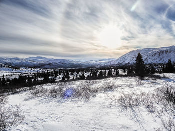 Scenic view of snowcapped mountains against sky