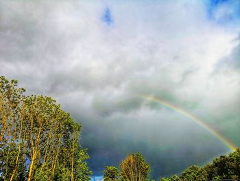 Low angle view of rainbow against sky