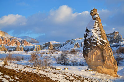 Scenic view of snow covered mountains against sky