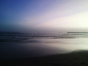 Scenic view of beach against sky during sunset