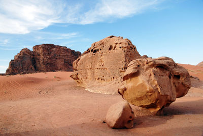 Rock formations in desert against sky