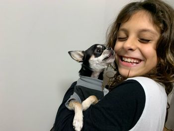 Portrait of smiling woman with dog