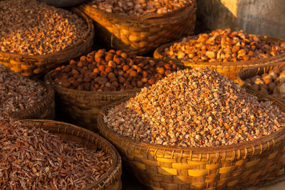 High angle view of food in wicker baskets at street market stall