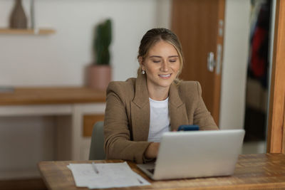 Woman working at home with laptop. home office.  notebook for working. 