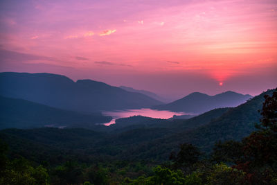 Scenic view of mountains against sky during sunset