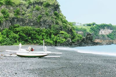 Boat  between beach and sea