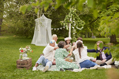 Family raising toast at picnic