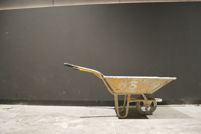 Close-up of vintage car on table against wall