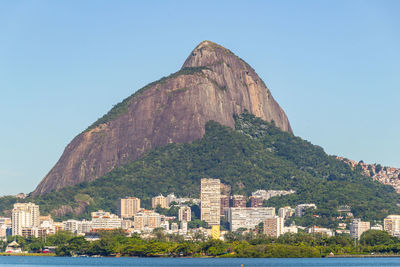 Low angle view of buildings against mountain