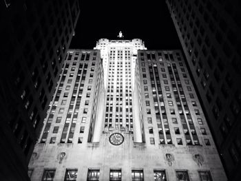 Low angle view of modern building at night
