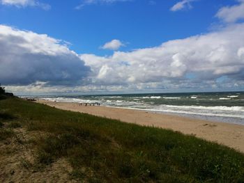 Scenic view of sea against cloudy sky