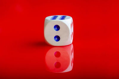 Close-up of dices on red background