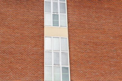 Low angle view of window on building wall