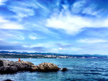 Scenic view of sea against cloudy sky