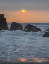 Scenic view of sea against sky during sunset