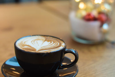 Close-up of cappuccino on table