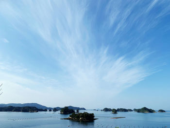 Scenic view of sea against blue sky