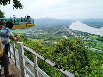 People looking at view of mountain