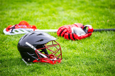 View of red umbrella on field