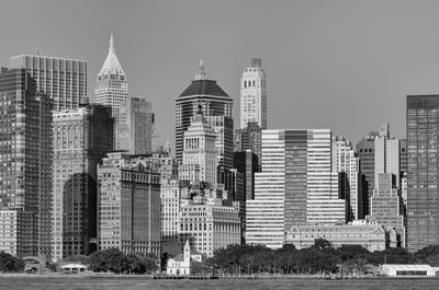 Skyscrapers in city against clear sky