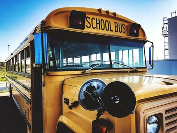 Close-up of school bus on footpath