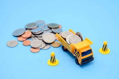 High angle view of various toys on blue background