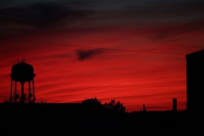 Low angle view of silhouette trees against sky during sunset