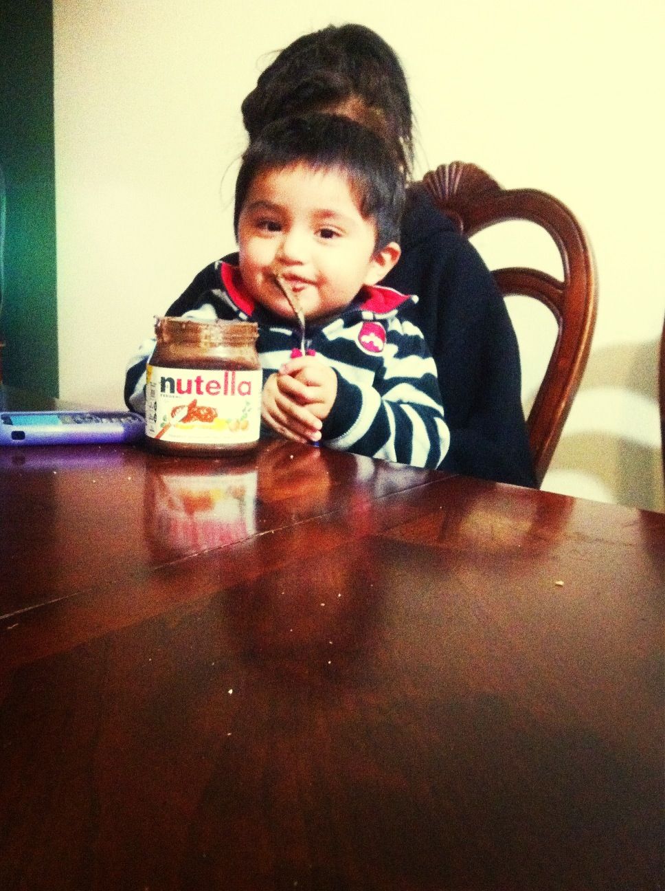 Jaythan eating nutella