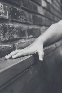 Close-up of person playing on wall