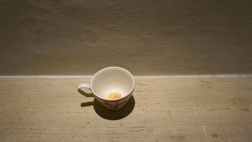 High angle view of coffee cup on table