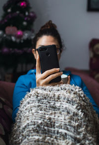 Midsection of man using mobile phone