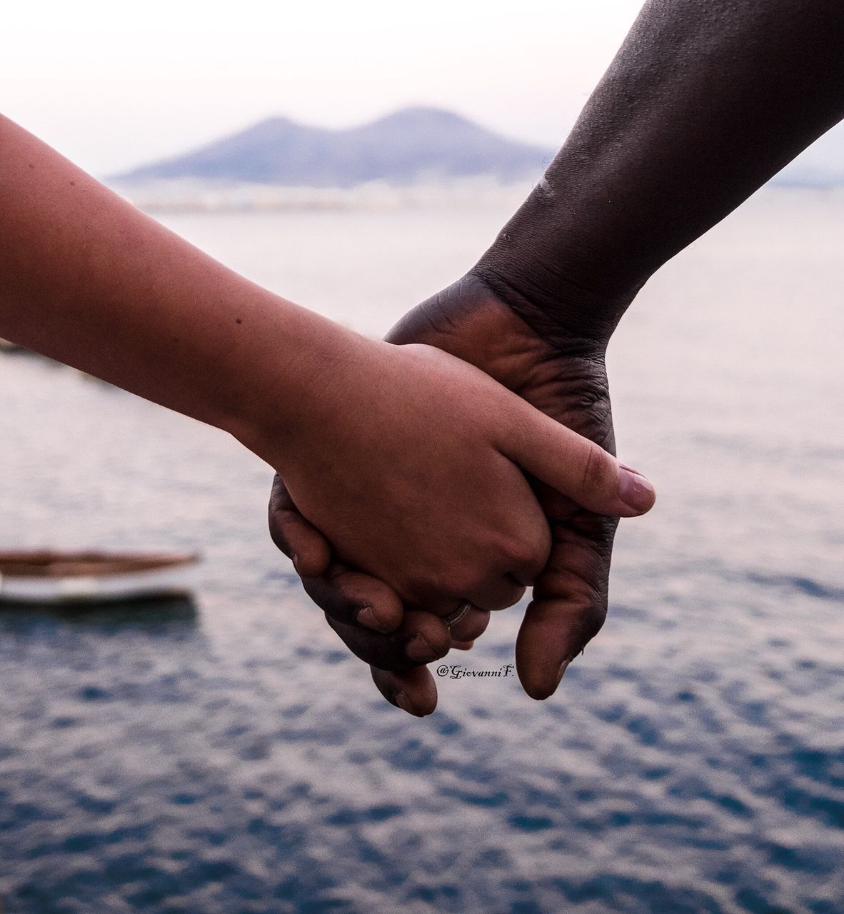 human hand, water, human body part, real people, sea, focus on foreground, togetherness, close-up, outdoors, nature, day, two people, childhood, beach, friendship, sky, people