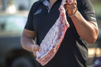 Man holding beef