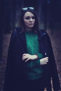 Portrait of young woman in traditional clothing standing outdoors