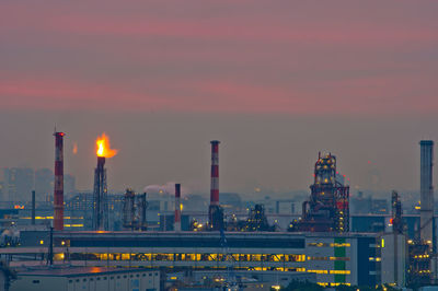 Sunset sky and oil refineries