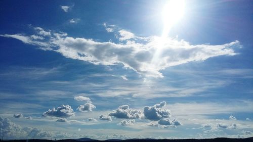 Low angle view of sun in sky