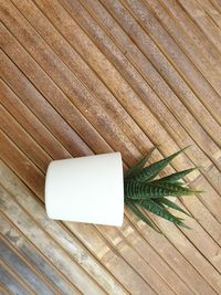 High angle view of wooden plank on table